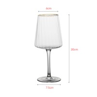 Luxury crystal wine glass with royal gold rim