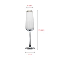 Luxury champagne glass with elegant gold rim painting and special texture inside